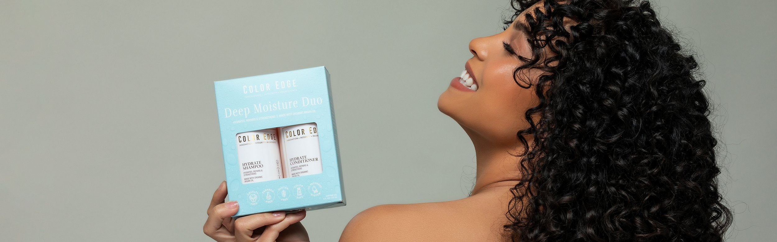 Woman holding up Deep Moisture Duo