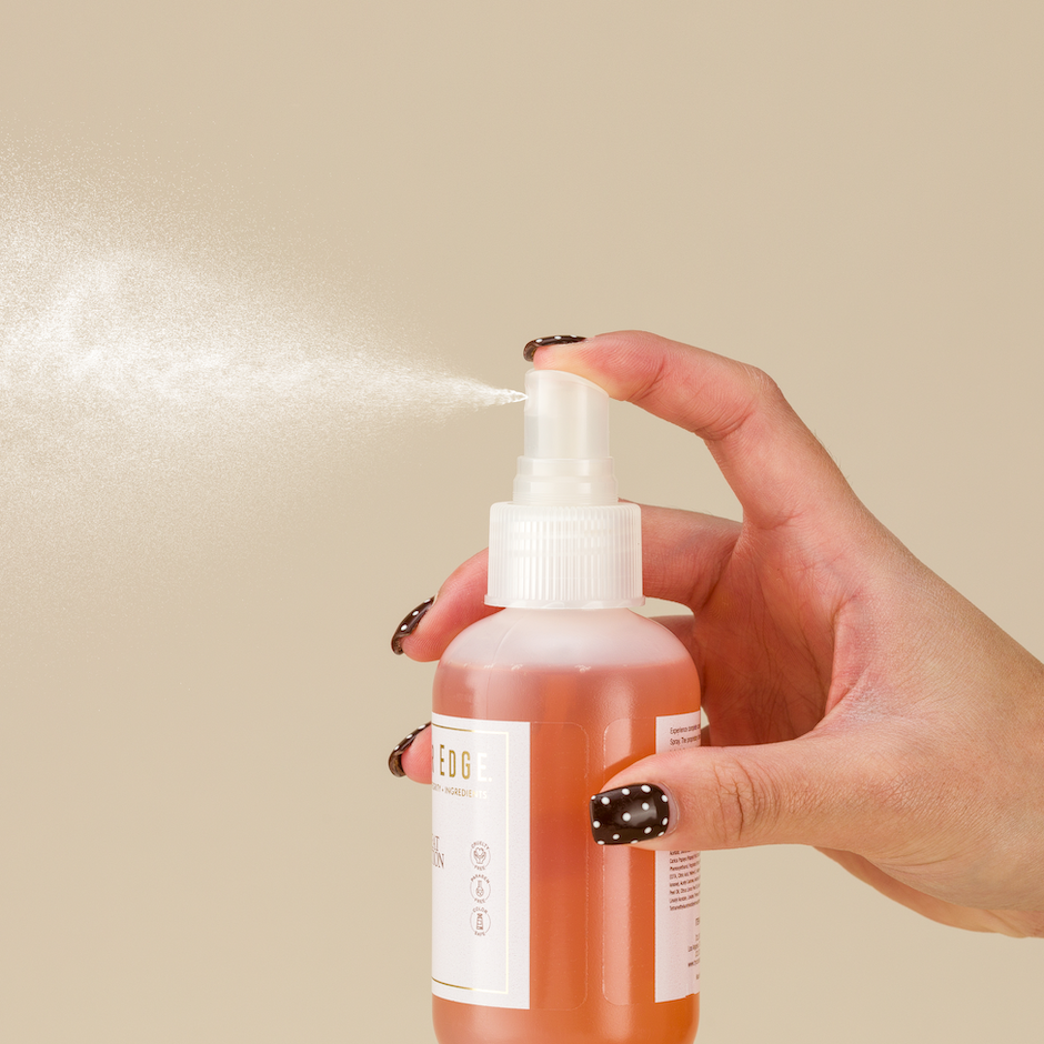 4-in-1 Heat Protection being sprayed