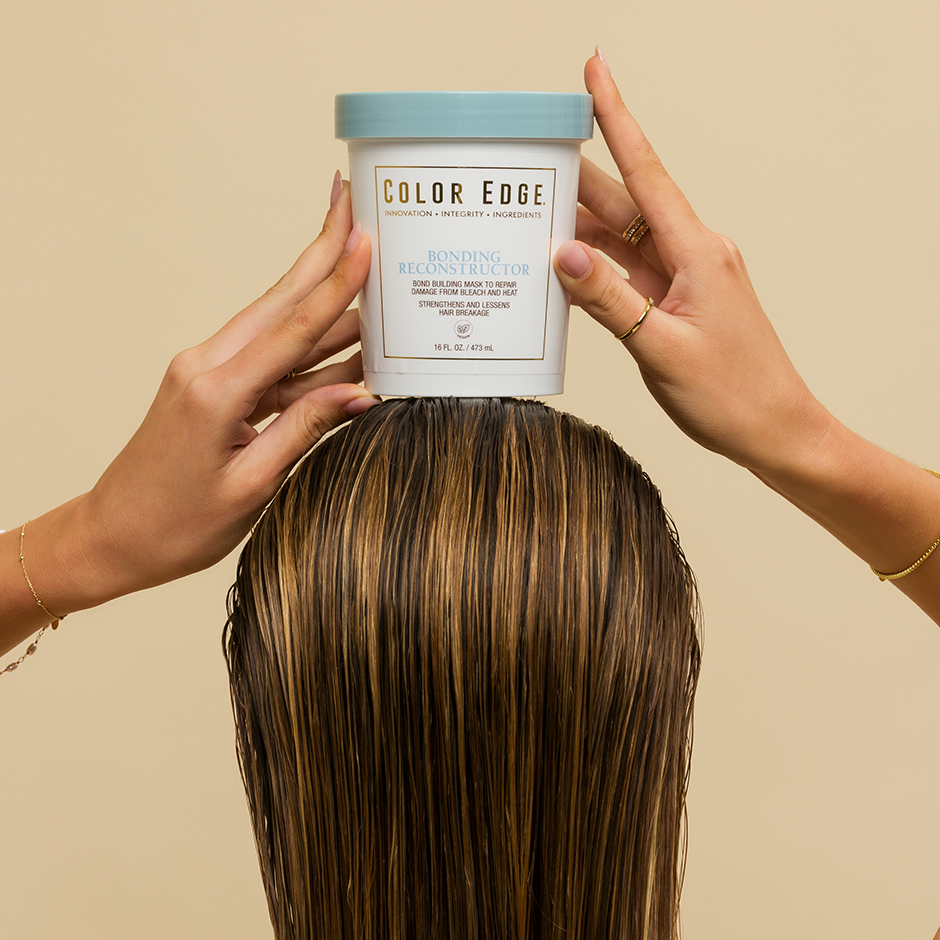 Girl using Bonding Reconstructor in wet hair