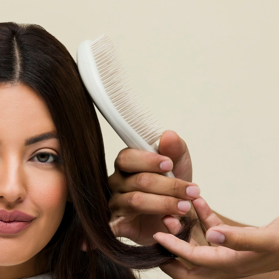 Stylish brushing clients hair with Detangle Brush