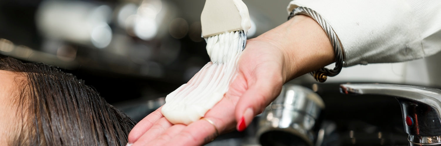 Stylist applying hair mask