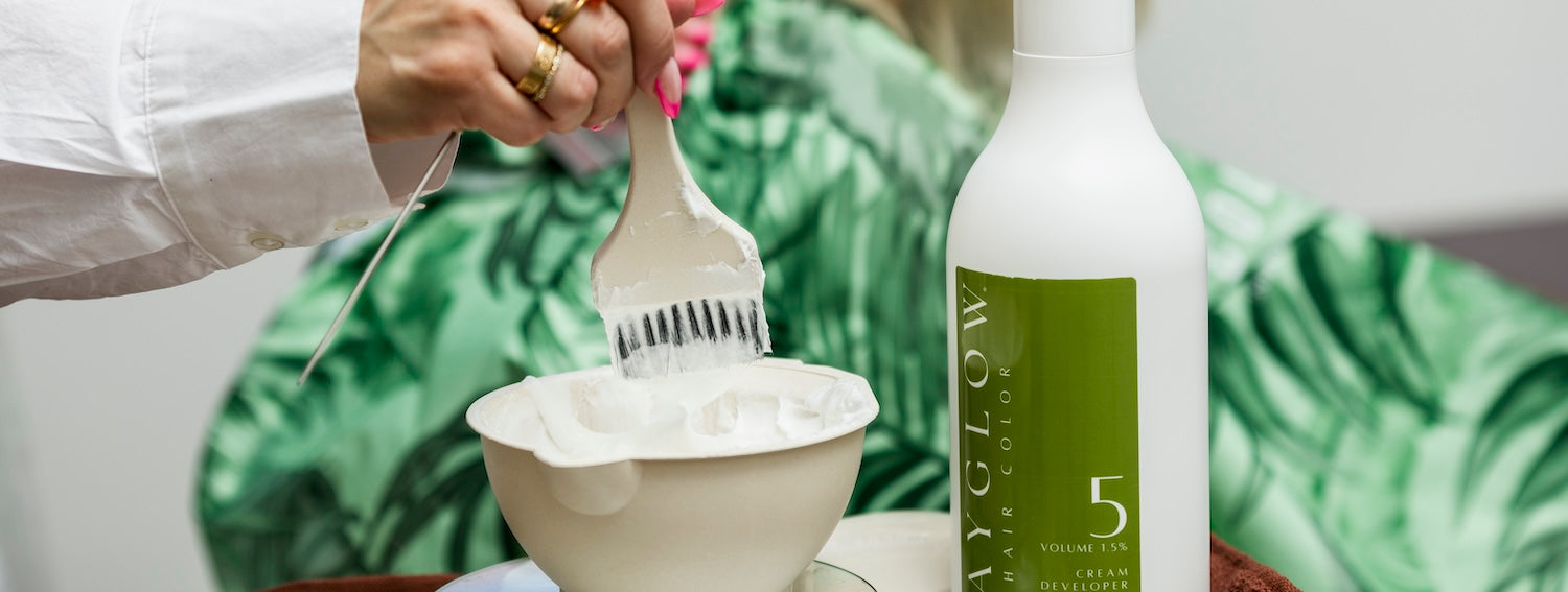 Stylist performing bleaching service