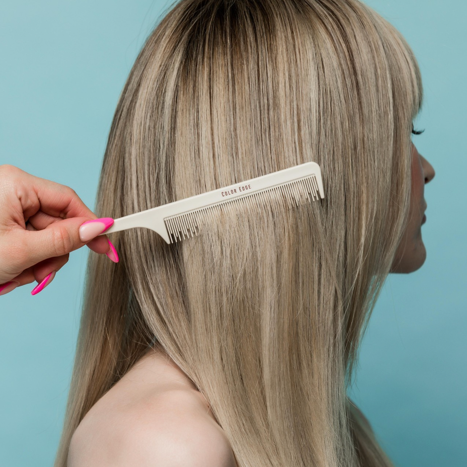 Carbon Comb brushing through blonde hair