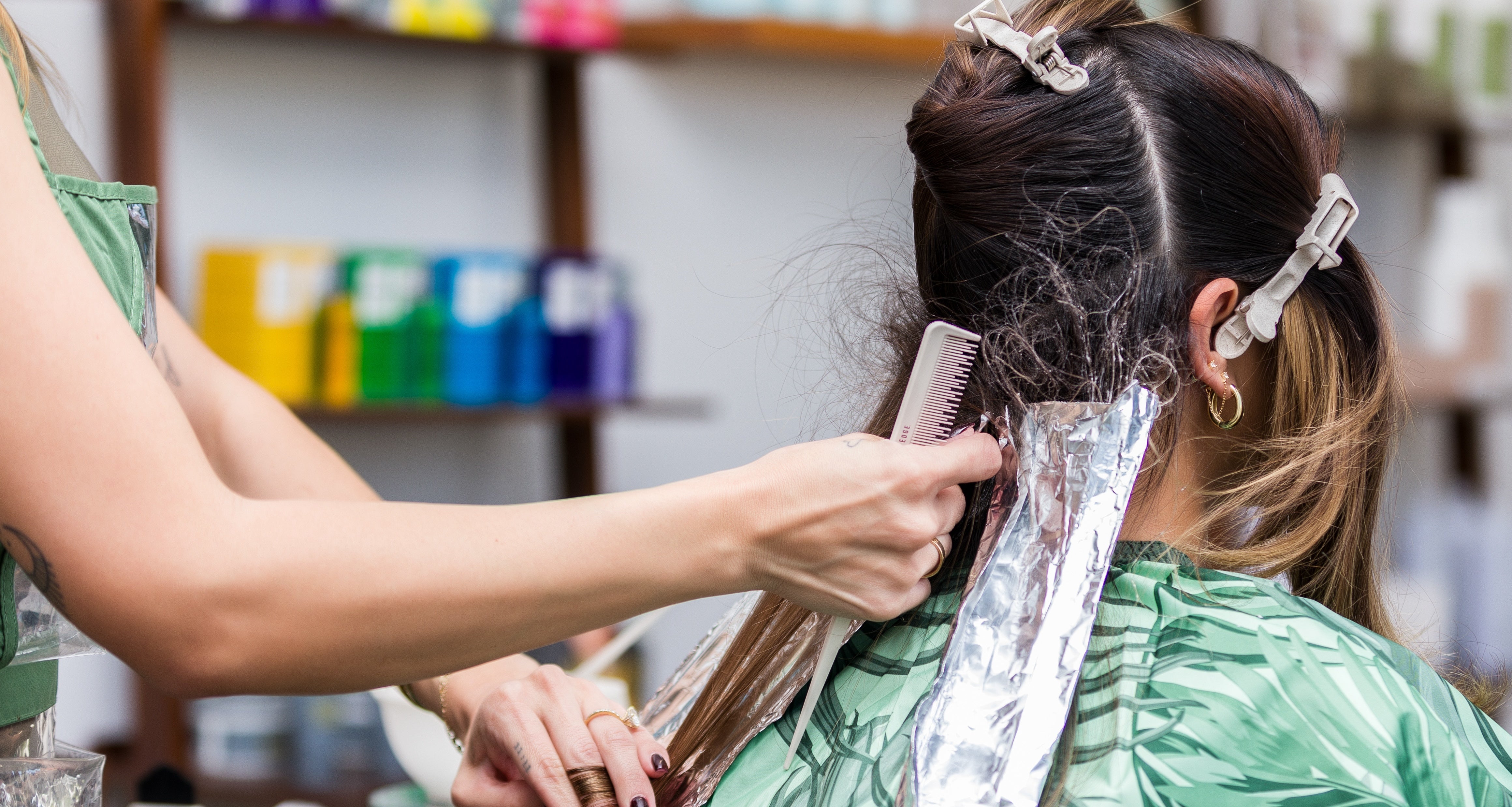 Stylist bleaching hair