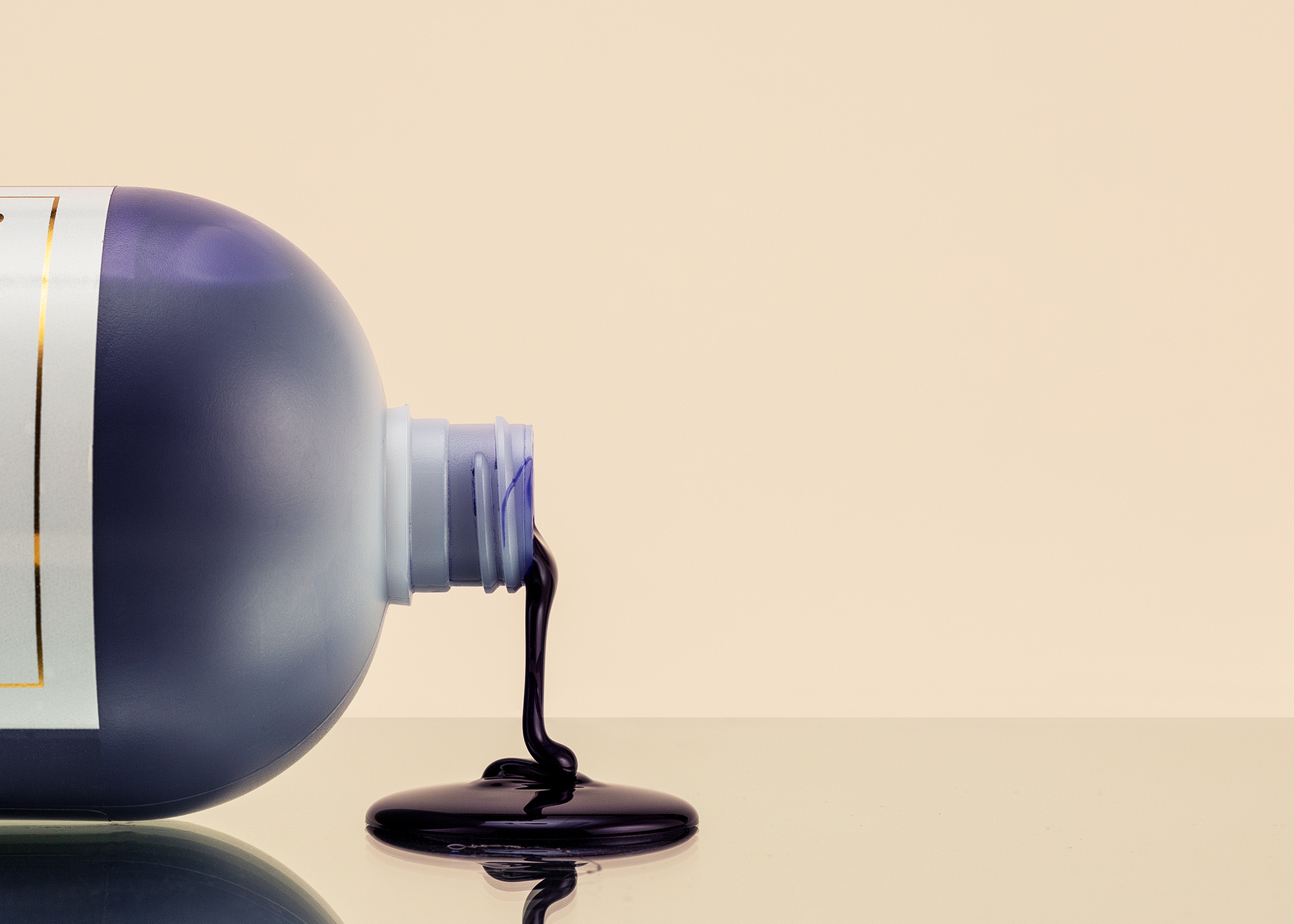 Color Edge Frosty Shampoo spilling over onto table